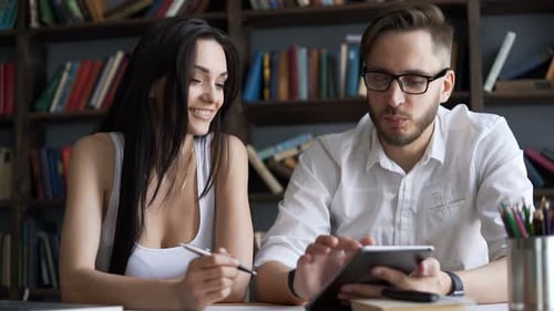 Two Beautiful Smart 20s Students Close Up Speak in Campus Library Use