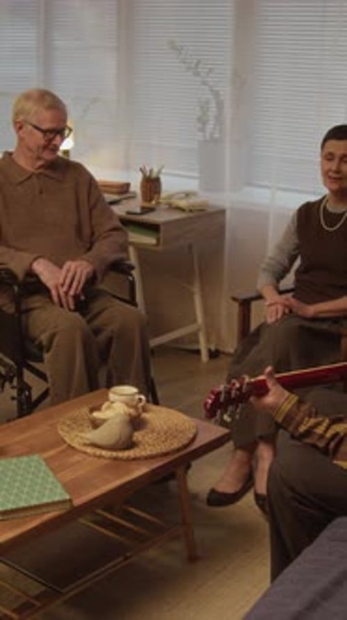 Group of Diverse Seniors Singing Together in Cozy Nursing Home