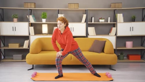 Woman doing leg and stretching exercises.