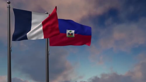 France and Haiti National Flags Waving Against Blue Sky