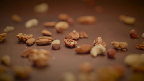 Variety of Nuts Scattered on a Wooden Surface
