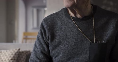 Injury, knee surgery and senior man in recovery at a medical rehabilitation center or clinic