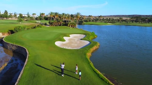 Scenic Golf Course with People Playing Golf