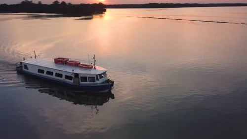 river boat sunset beautiful colorful mirrored drone