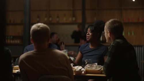 Friends Toasting and Celebrating Together at Night