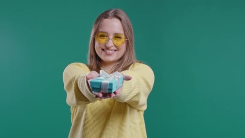 Blonde Woman Giving a Birthday Gift