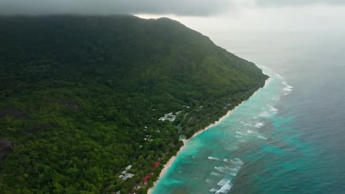 Aerial drone view of travel destination exotic beach resort in the Seychelles Islands. View of the t