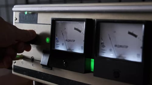 Hand Adjusting Knob on Electrical Device