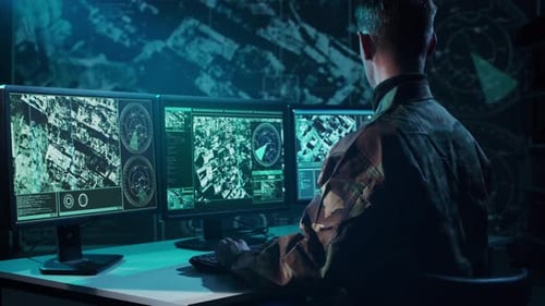 Military Soldier Operating Advanced Technology in a Command Center