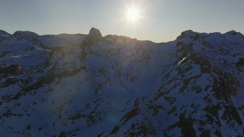 Bright Sun Shining Over Snowy Mountain Peaks in Pyrenees Mountains Spain