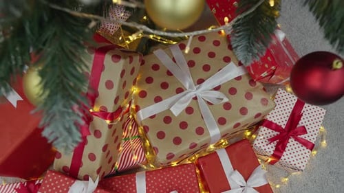 Decorated Christmas Tree with Festive Gifts Overhead