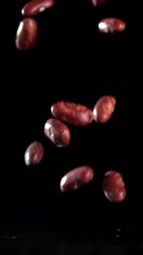 Red Beans Fall on the Table Filmed on a Highspeed Camera at 1000 Fps