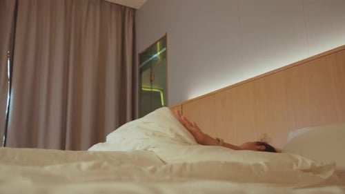 Woman Prepares for Day Peacefully Gentle Morning Scene of Woman in Boutique Hotel Room Relaxing
