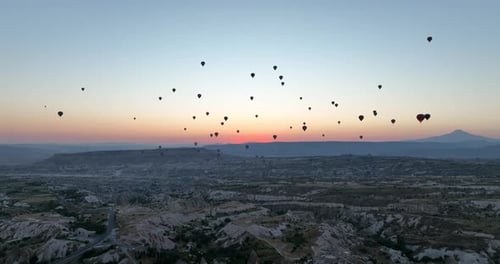 Aerial Cinematic Drone View of Colorful Hot Air Balloon Flying Over Cappadocia