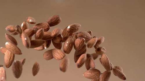 Almonds flying in slow motion food shot