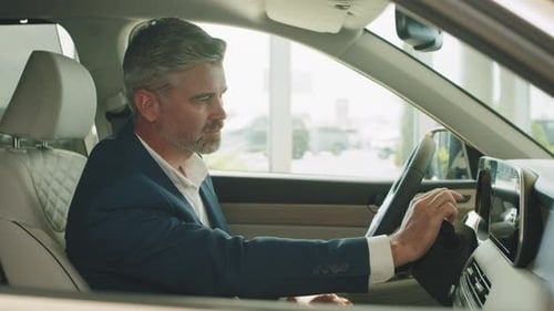 Man Interacts With Screen in Car