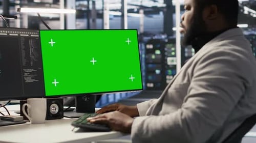 Data Center Programmer Working on Green Screen Desktop PC