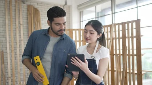 Woodworkers Use Tablet for Project Ideas Indoors