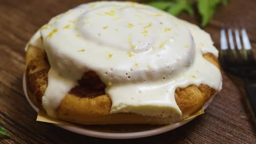 Cinnamon Roll on a Plate with Frosting