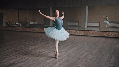 Ballerina Dancing Gracefully in a Dance Studio