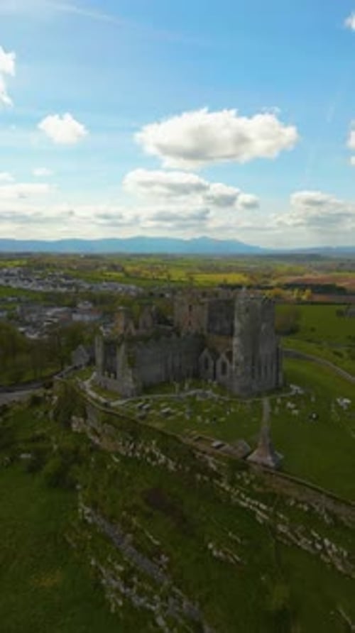 Aerial vertical view of the Rock of Cashel, capturing ancient stone walls, round towers, and