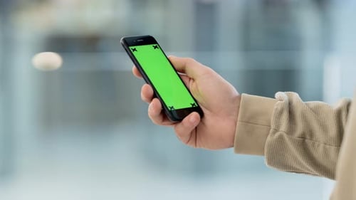 Person holding a phone in their hand and browsing the internet online