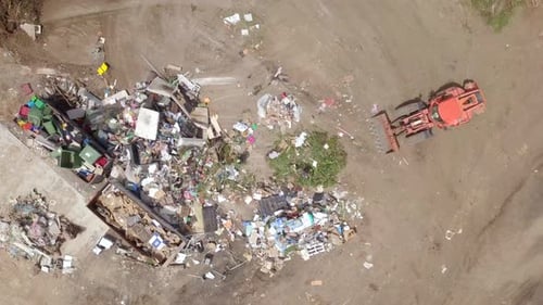 City landfill with trucks and compactors at work
