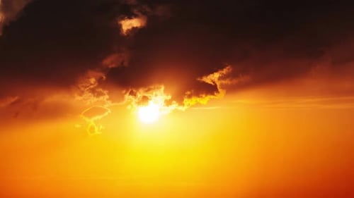 Golden Sunset with Dramatic Clouds and Shining Sun