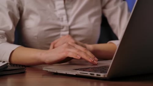 Close Up of Hands Typing on Laptop Keyboard