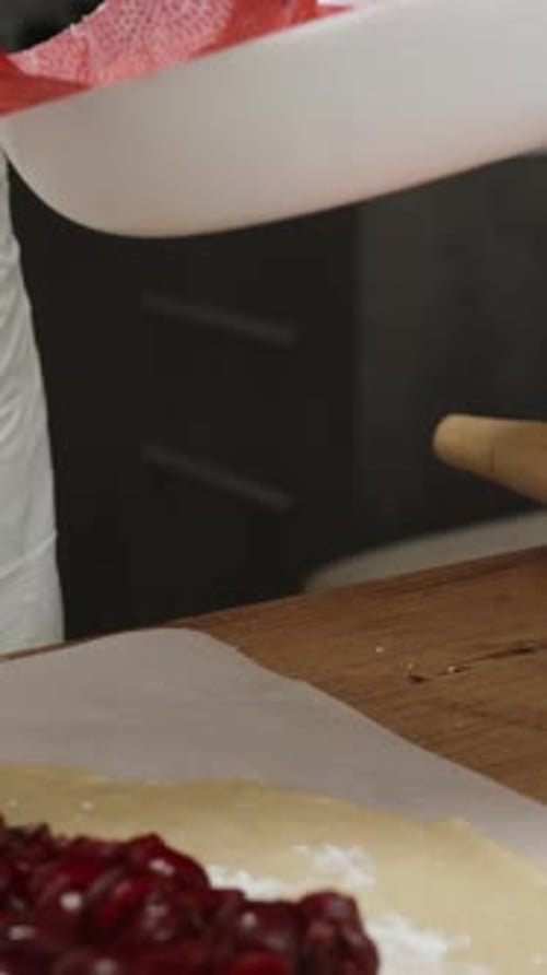 Chef Adds Cherries to Fresh Pastry Dough