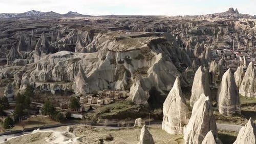 Aerial video of a panoramic view of natural rock formations in Cappadocia, Turkey