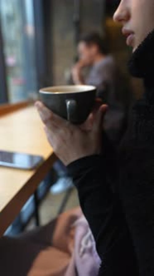 Close Up Portrait of Young Beautiful Girl Drinking Coffee