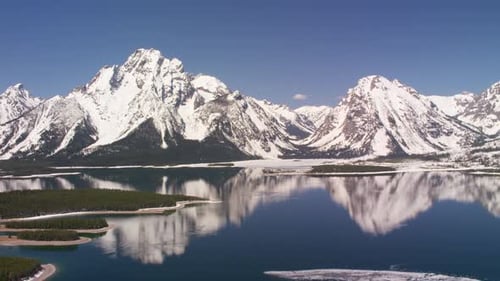 Grand teton national park Wyoming snow capped peaks and jackson lake aerial view