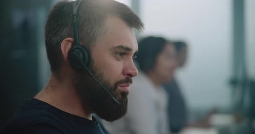Close Up Portrait of Caucasian Technical Support Specialist in Headset Communicating