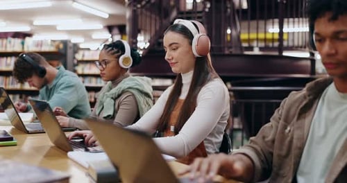 Girl, student and headphones with laptop in library for writing assignment essay