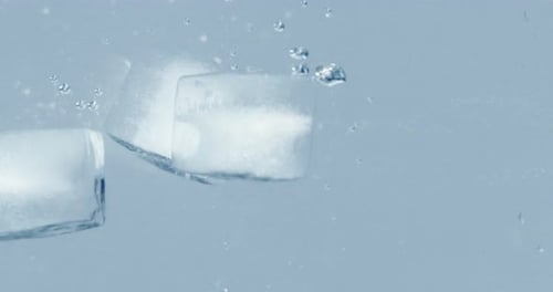 Ice Cubes Falling in Water Slow Motion