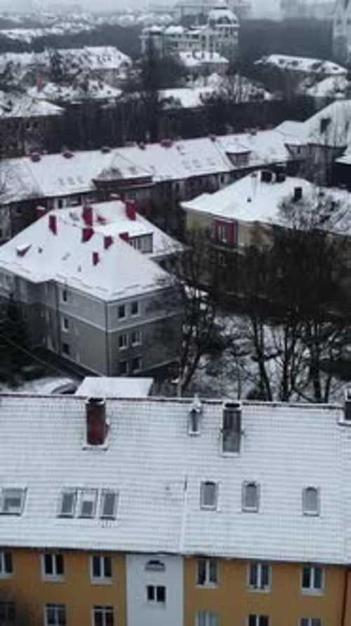 Aerial View of Snow Covered City Buildings Media