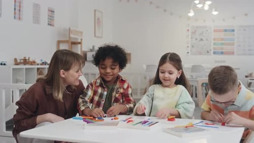 Kids Crafting With Play Dough in Classroom Setting