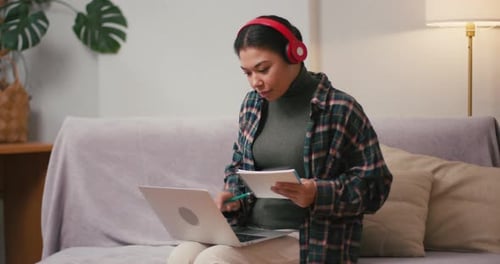 Adult Studying with a Laptop at Home
