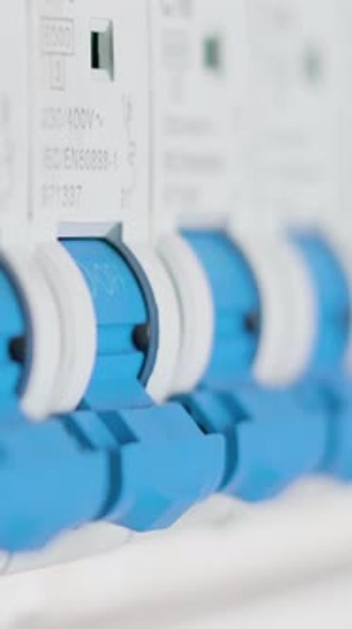 Man flipping a single circuit breaker switch on and off. Electrical cabinet. Extreme close up