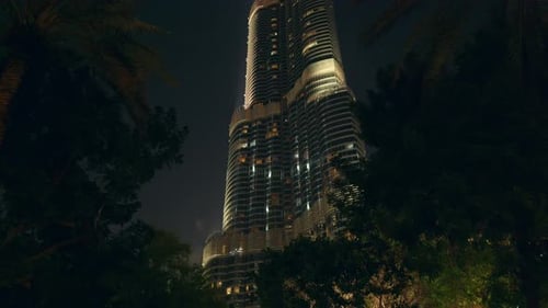 Tilt shot of the Burj Khalifa in cloudy sky, Burj Khalifa is the world's tallest skyscraper, at nigh