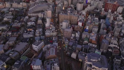 High Angle View of Street Leading Through Urban Borough Fly Above Buildings in Metropolis at Dusk