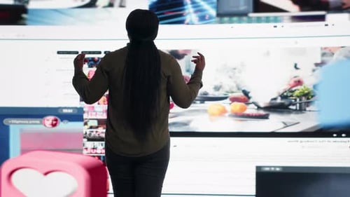 Data Center Technician Runs Equipment Checkups Using Digital Device