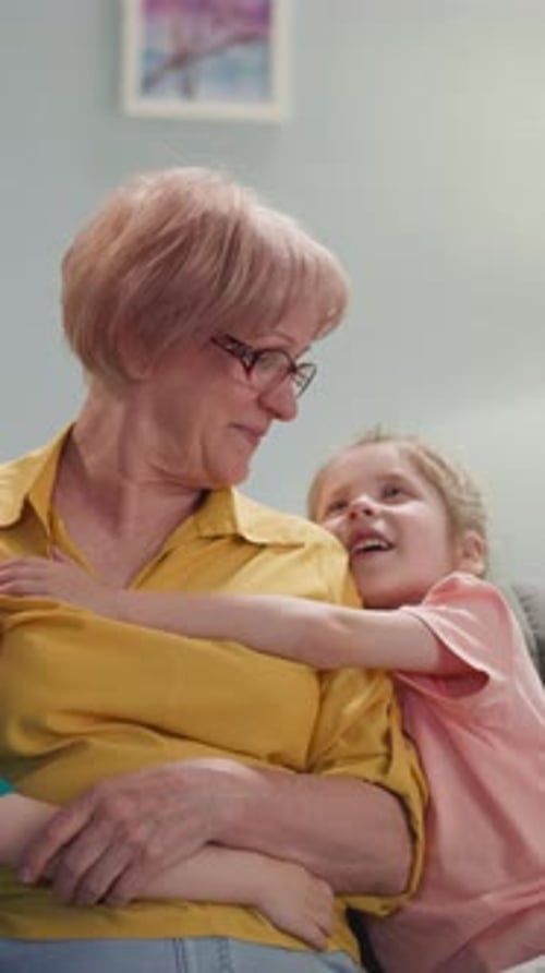 Loving Grandmother Hugs Grandchildren in Cozy Home Interior