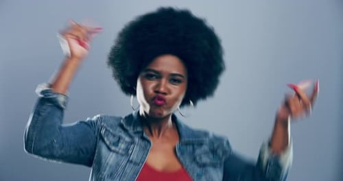 Energetic Woman Dancing and Smiling in Studio