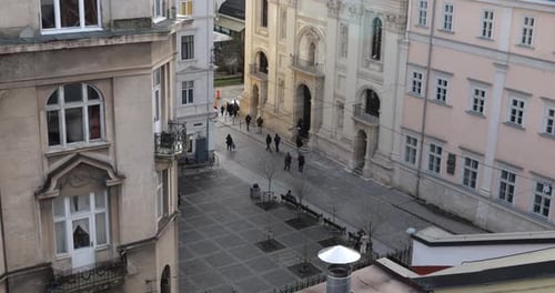 People on the square of an old European city. Architecture.