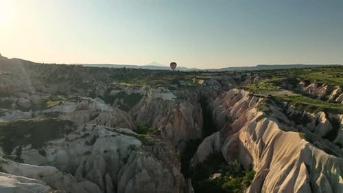 Hot Air Balloons Fly Over the Mountainous Landscape of Cappadocia Turkey