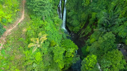Aerial Top View of Beautiful Aling Aling Waterfall in Nothern Bali Indonesia