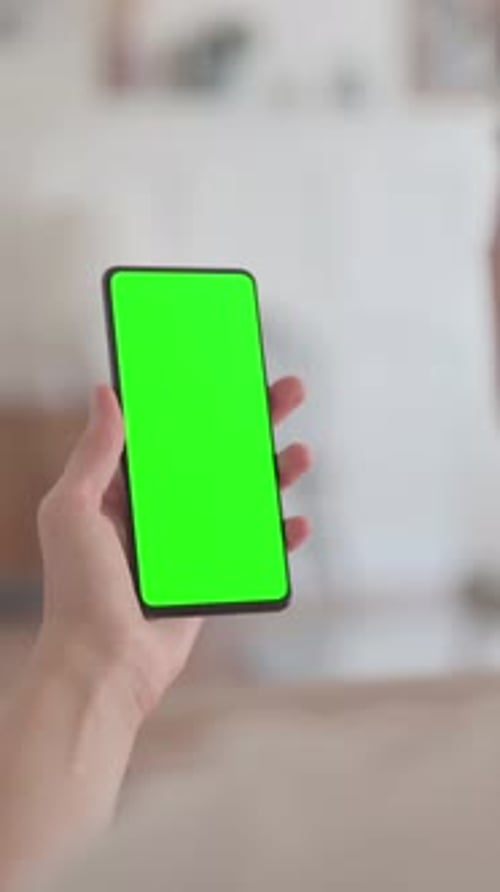 Rear View of Woman using Smartphone with Green Chroma Screen, Vertical Video