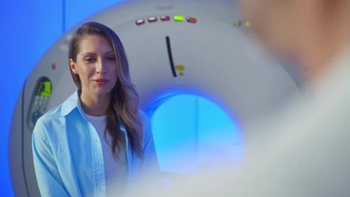 Medical Worker Explaining CT Scan Results to Patient in Hospital Setting MRI Machine and